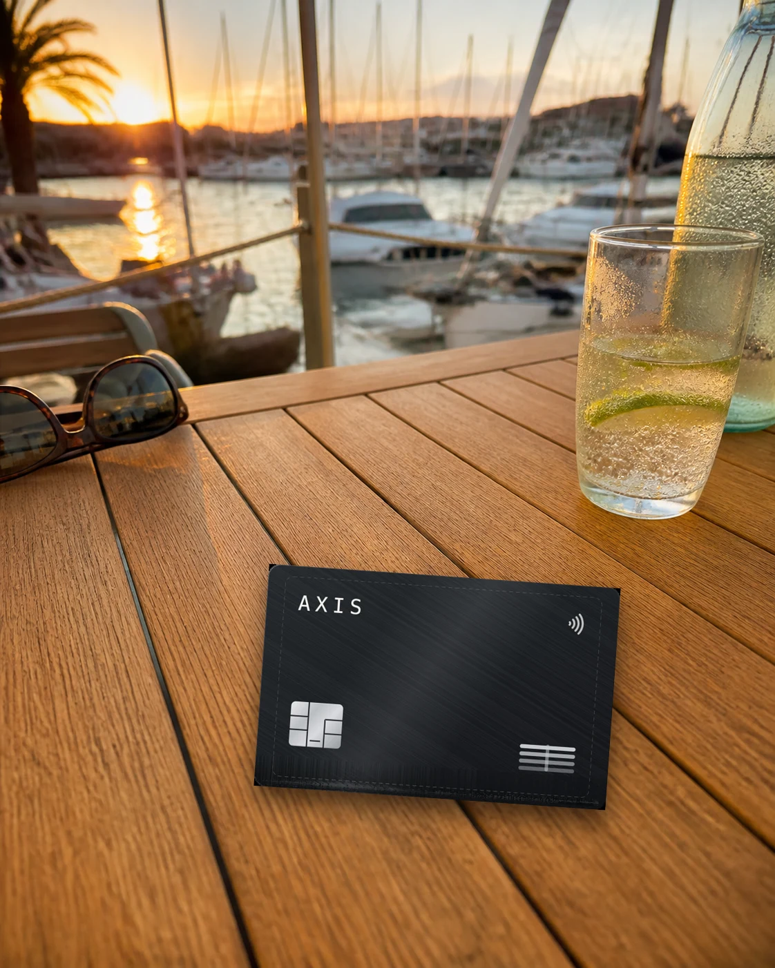 The AXIS card on a table by a marina at sunset